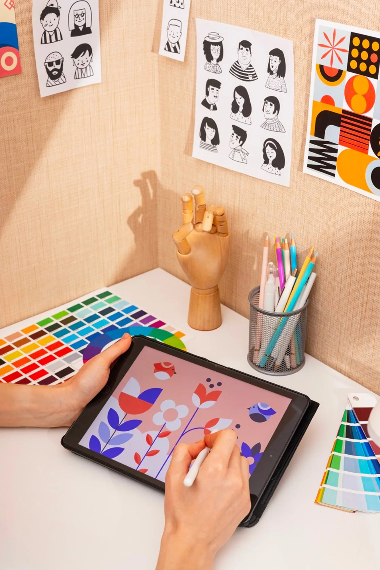 A designer choosing colours on a tablet in a design studio