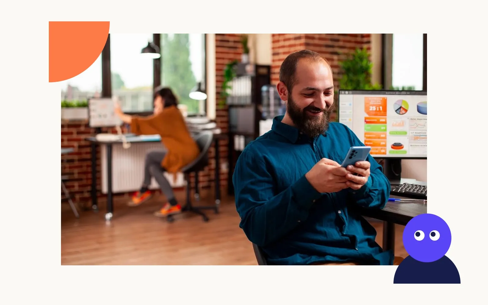 A man smiling as he reads search results on his phone in an office