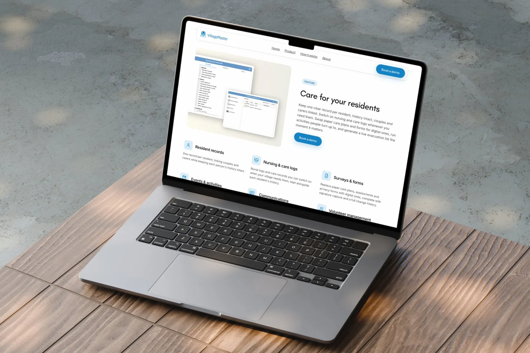 VillageMaster website on a laptop