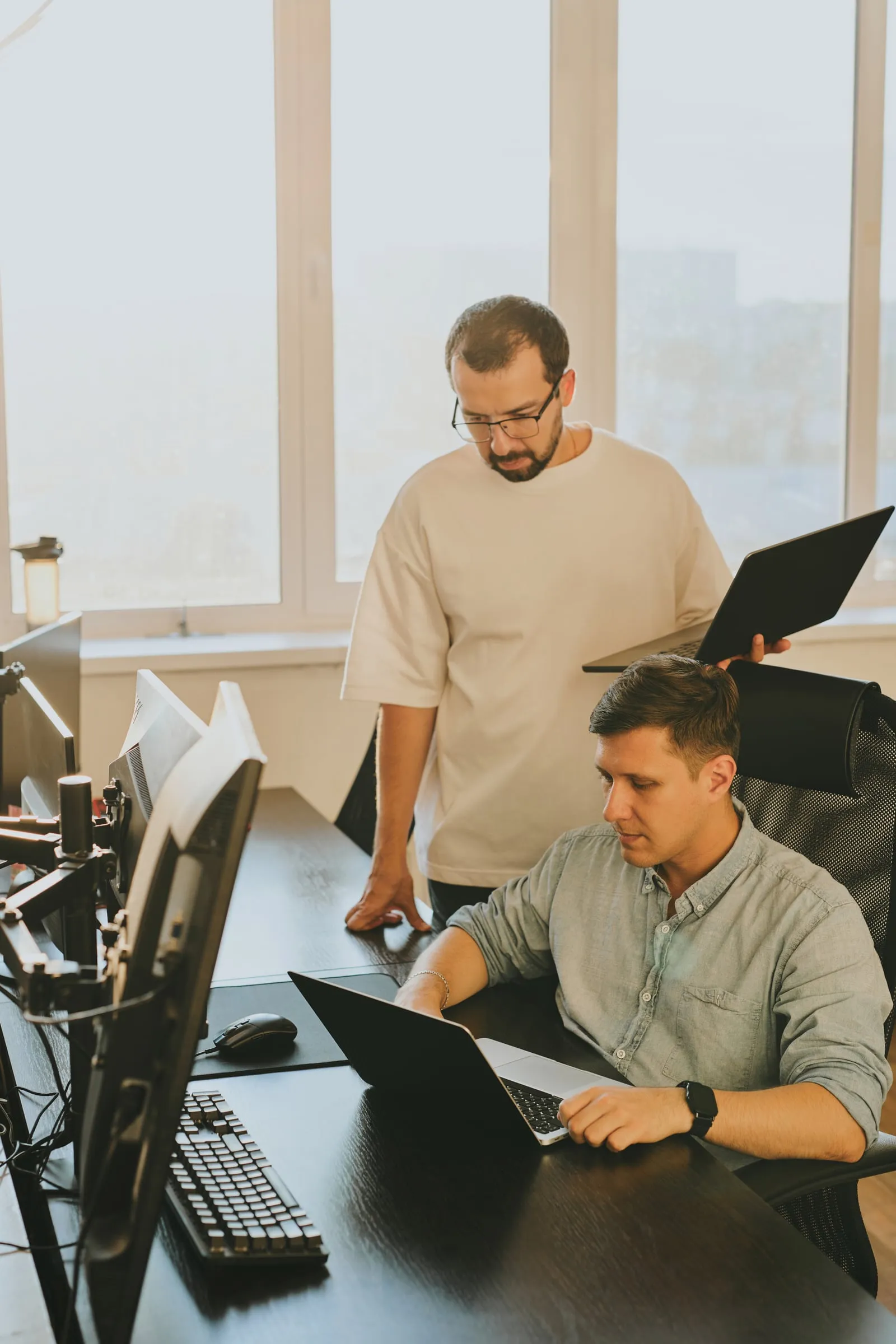 Two developers working together at a desk